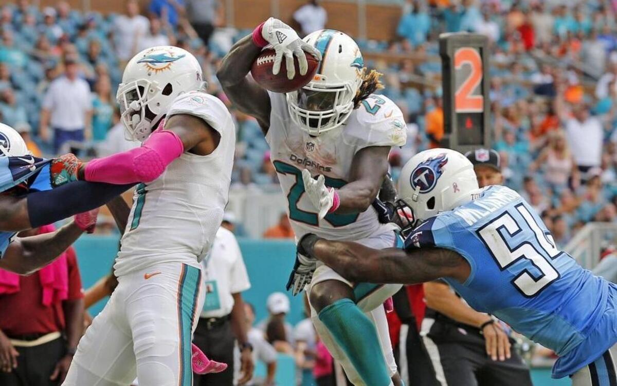 Miami Dolphins Jay Ajayi dives into the endzone for a third quarter touchdown that was reversed because of a penalty as thy play the Tennessee Titans at the Hard Rock Stadium in Miami Gardens, Florida on Sun., Oct. 9, 2016.