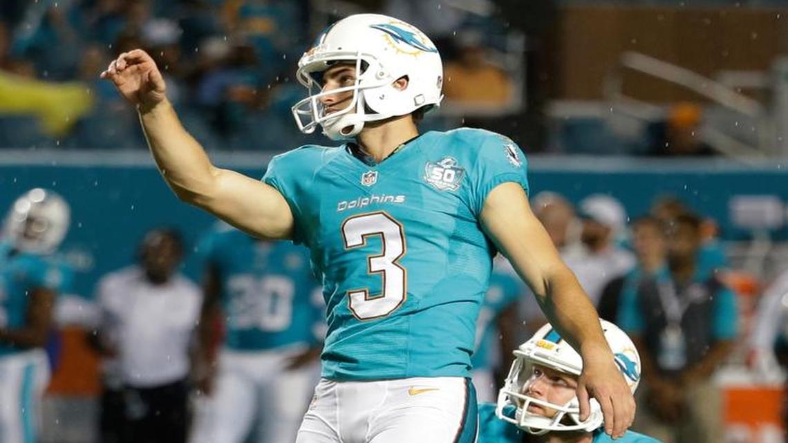 
Miami Dolphins kicker Andrew Franks (3) watches his field goal kick during the second half of an NFL preseason football game against the Atlanta Falcons, Saturday, Aug. 29, 2015 in Miami Gardens, Fla. To the right is Miami Dolphins punter Matt Darr (4). 
