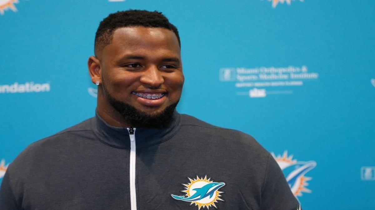 Miami Dolphins draft pick Davon Godchaux smiles as he speaks during a news conference on Friday.