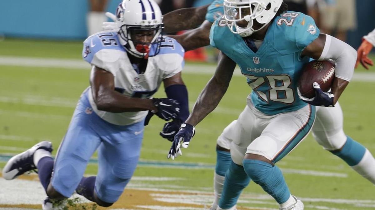 Miami Dolphins cornerback Bobby McCain (28) intercepts a pass intended for Tennessee Titans wide receiver Justin Hunter (15) during the first half of an NFL preseason football game, Thursday, Sept. 1, 2016 in Miami Gardens.