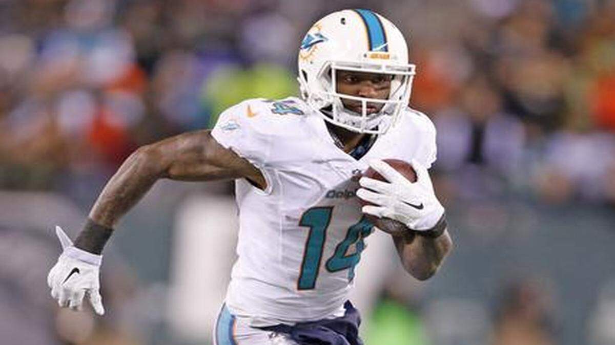 
Jarvis Landry runs the ball as the Miami Dolphins take on the New York Jets at MetLife Stadium in East Rutherford, New Jersey on Monday, December 1, 2014.
