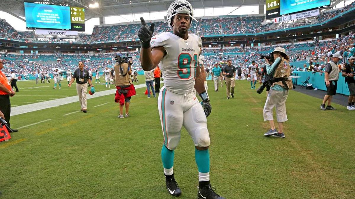 Miami Dolphins defensive end Cameron Wake (91) walks off the field in the third quarter after a second weather delay of the game suspends play as the Miami Dolphins host the Tennessee Titans on Sept. 9.