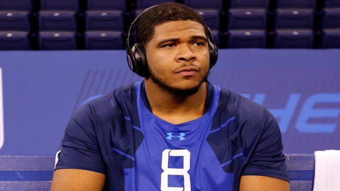
La'El Collins sits on a bench at the NFL football scouting combine in Indianapolis on Feb. 20, 2015. 
