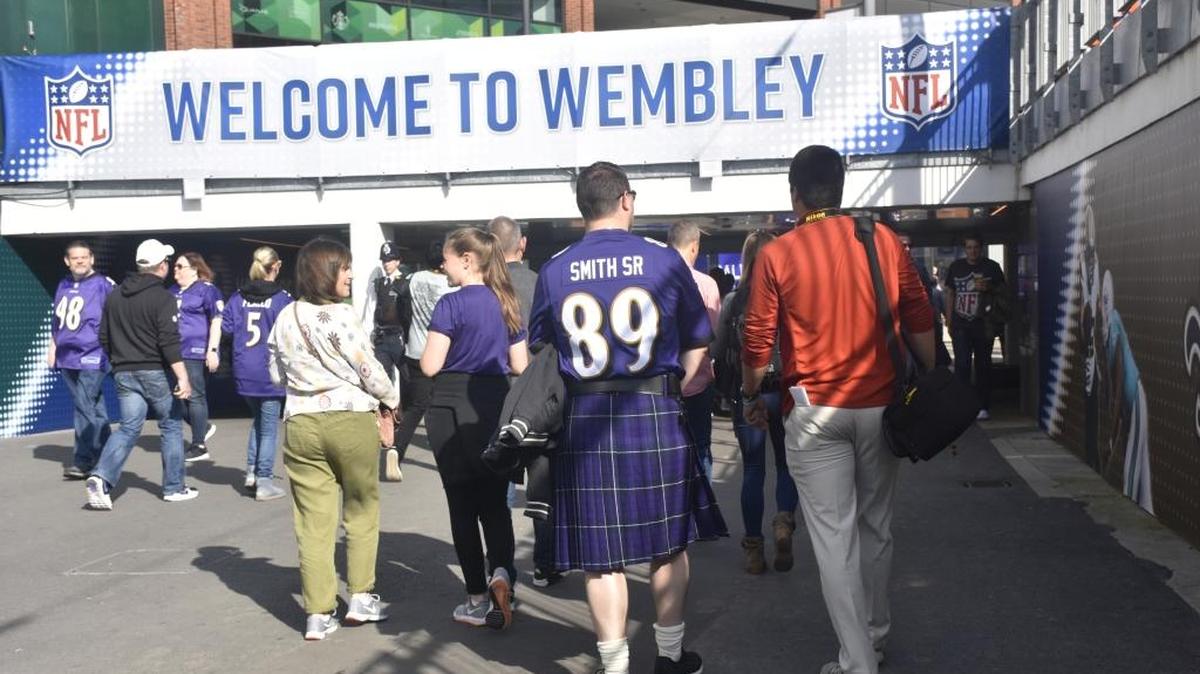 Fans enter the Wembley Stadium complex for the Baltimore Ravens-Jacksonville Jaguars game in London on Sept. 24, 2017.