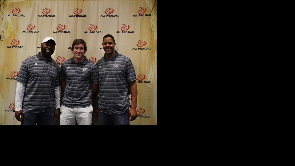 
From left to right, Lousaka Polite, Dolphins’ Caleb Sturgis and Twan Russell pose for a photo during an All Pro Dad event at Nova Southeastern University in Davie on Feb. 21, 2015. The NFL athletes were among more than 1,000 participants who attended the event and encouraged fathers to play a more active role in their child's life.
