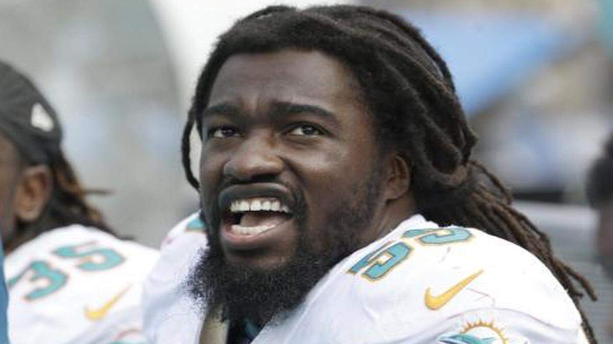 
Dolphins linebacker Dannell Ellerbe looks on during the season opener against the New England Patriots on Sept. 7, 2014, when he sustained a season-ending hip injury.. 
