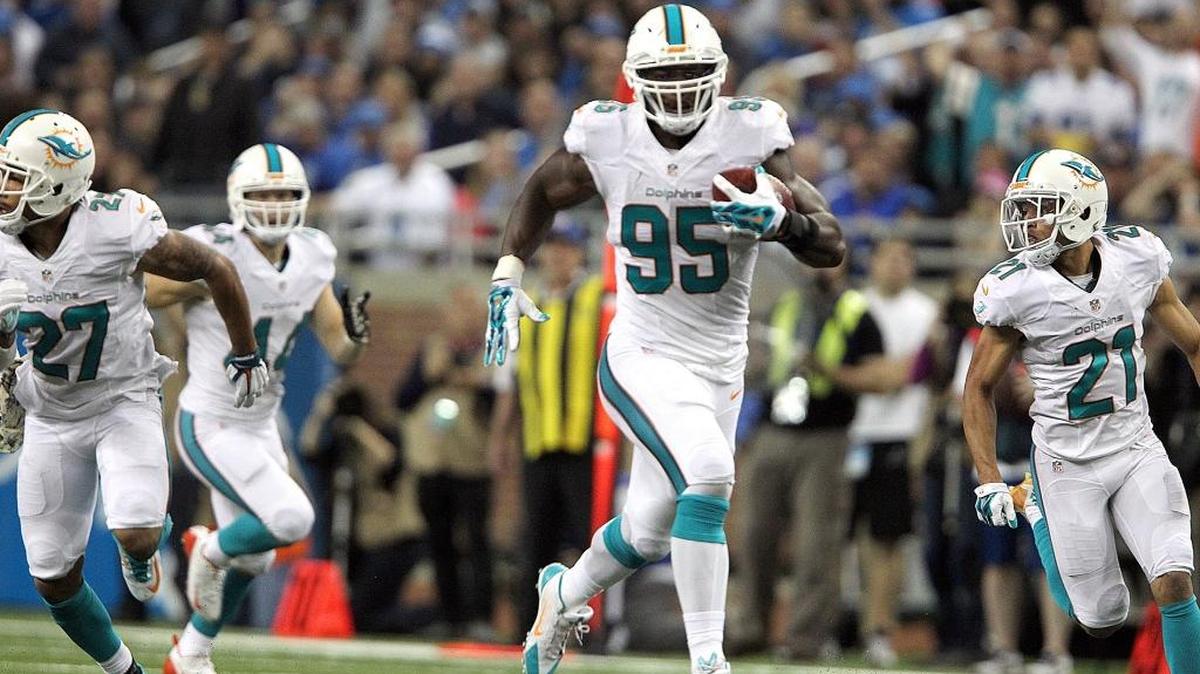 Miami’s Dion Jordan picks up a blocked field goal and takes off down the field in a game at Detroit in 2014.