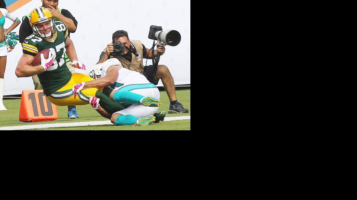 
Green Bay Packers receiver Jordy Nelson makes a catch over Miami Dolphins defensive back Brent Grimes late in the fourth quarter of their game at SunLife Stadium in Miami Gardens on Oct. 12, 2014.
