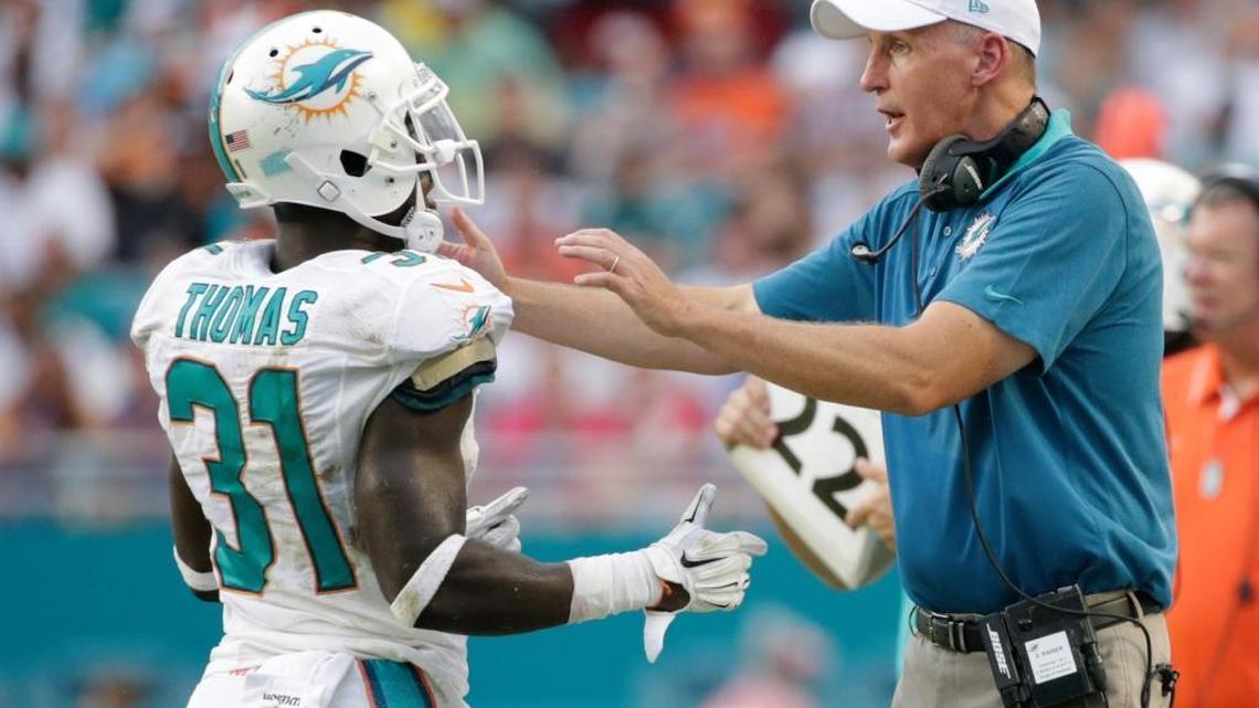 
Miami Dolphins coach Joe Philbin talks to free safety Michael Thomas during a game against the Buffalo Bills on Sunday, Sept. 27, 2015 in Miami Gardens, Fla. 

