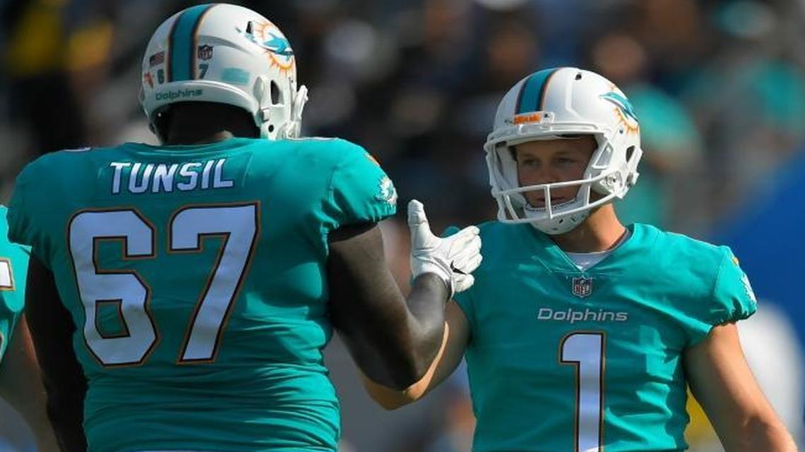 Miami Dolphins kicker Cody Parkey (1) celebrates with teammate offensive guard Laremy Tunsil (67) after booting a field goal during the second half of an NFL football game against the Los Angeles Chargers Sunday, Sept. 17, 2017, in Carson, Calif.