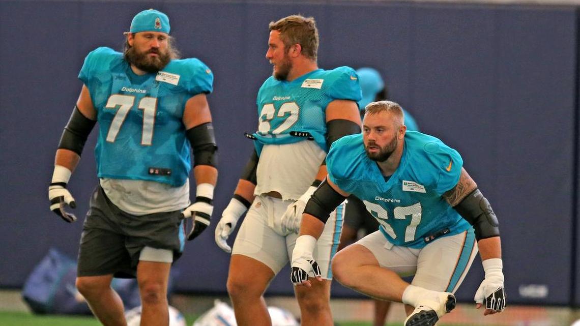 Miami Dolphins offensive linemen Josh Sitton, left, is injured and will be replaced in the lineup by Ted Larsen, center.