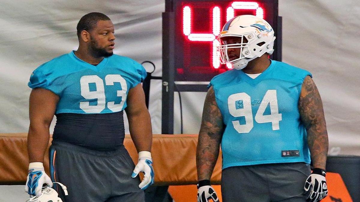 
Ndamukong Suh and C.J. Mosley practice during the Miami Dolphins’ minicamp in Davie on June 16, 2015.
