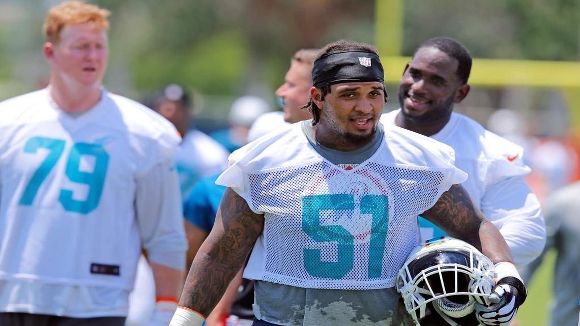 Miami Dolphins center Mike Pouncey (51) walks off the field after Dolphins mini-camp at Doctors Hospital Training Facility at Nova Southeastern University on Tuesday, June 14, 2016.