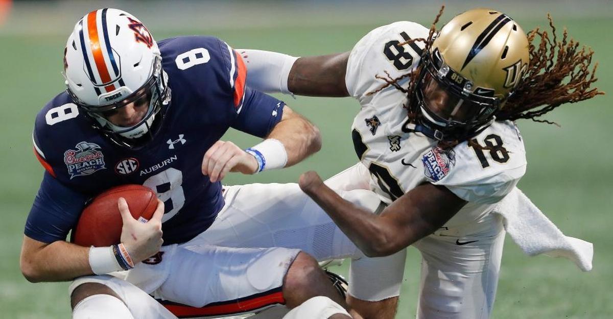 Central Florida linebacker Shaquem Griffin (18) sacks Auburn quarterback Jarrett Stidham (8) during the second half of the Peach Bowl NCAA college football game on Jan. 1, 2018, in Atlanta.