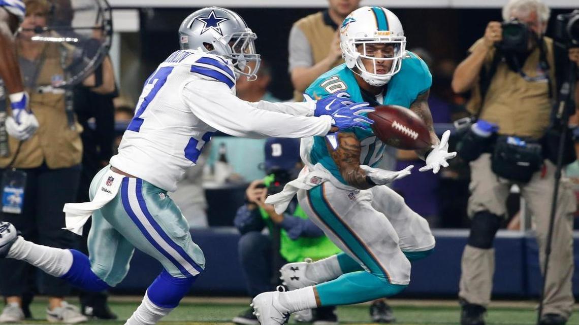 Dallas Cowboys defensive back Jeremiah McKinnon, left, is unable to stop Miami Dolphins wide receiver Kenny Stills (10) from making a catch for a touchdown in the end zone in the first half of an NFL preseason football game, Fri., Aug. 19, 2016, in Arlington, Texas.