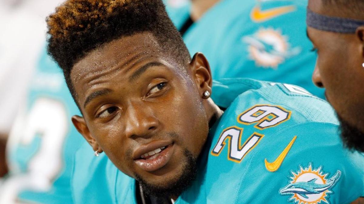 
Miami Dolphins cornerback Will Davis sits on the bench against the Carolina Panthers during the second half Saturday, Aug. 22, 2015, in Charlotte, N.C. 
