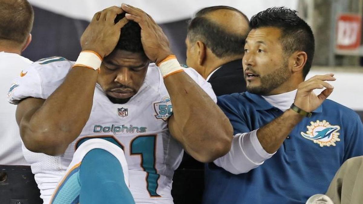 Miami Dolphins defensive end Cameron Wake is carted off during the fourth quarter against the New England Patriots on Thursday, Oct. 29, 2015 at Gillette Stadium in Foxborough, Mass. An MRI exam Friday confirmed Wake has a torn left Achilles and will miss the rest of the season.