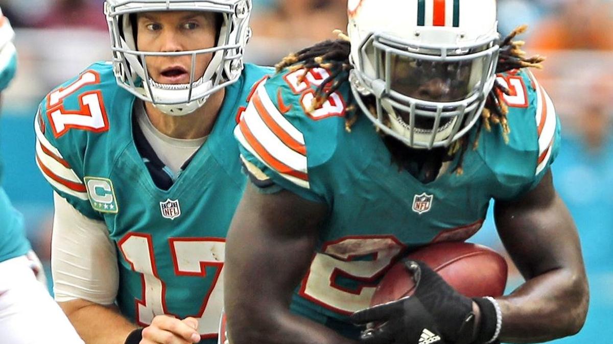 Running back Jay Ajayi takes a handoff from Ryan Tannehill during his 214-yard rushing game in a 28-25 victory against the Buffalo Bills on Sunday. Ajayi is the fourth player in NFL history to have back-to-back 200-yard games.