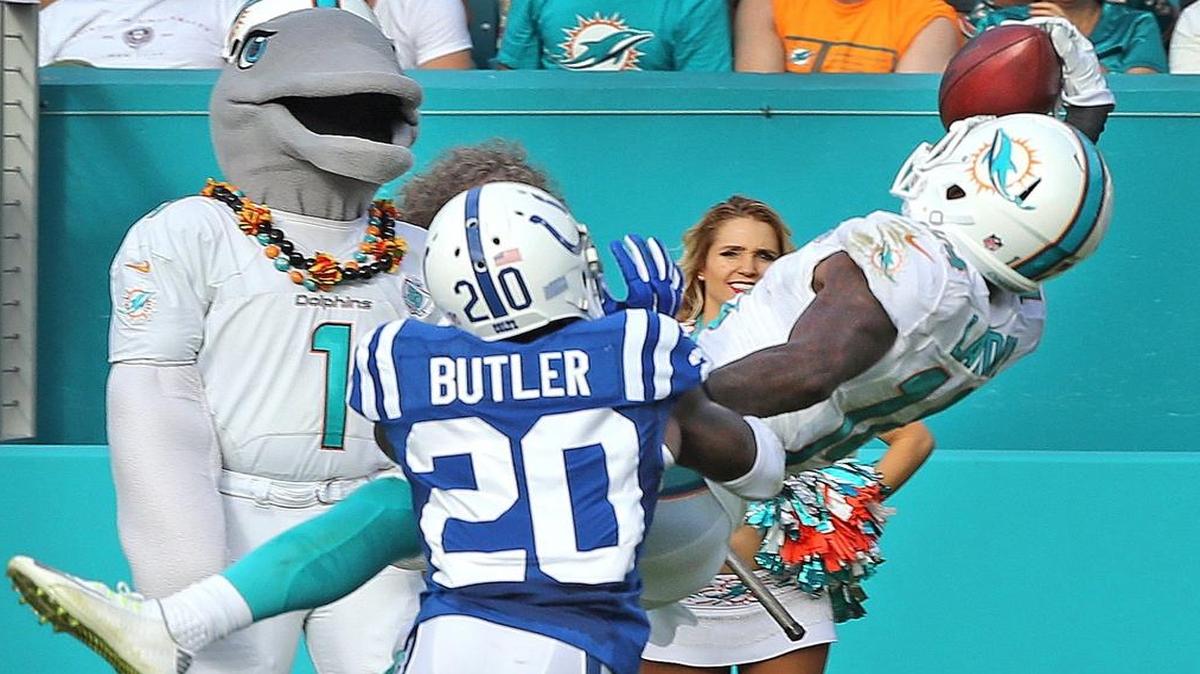 Miami Dolphins Jarvis Landry catches the ball with one hand as Indianapolis Colts Darius Butler defends in the fourth quarter at Sun Life Stadium in Miami Gardens, Florida, Dec. 27, 2015.