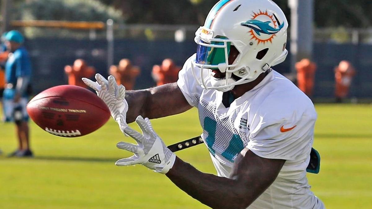 WR Jarvis Landry catches a ball during a drill at the Miami Dolphins training facility in Davie, Fla, Friday, Aug. 5, 2016.