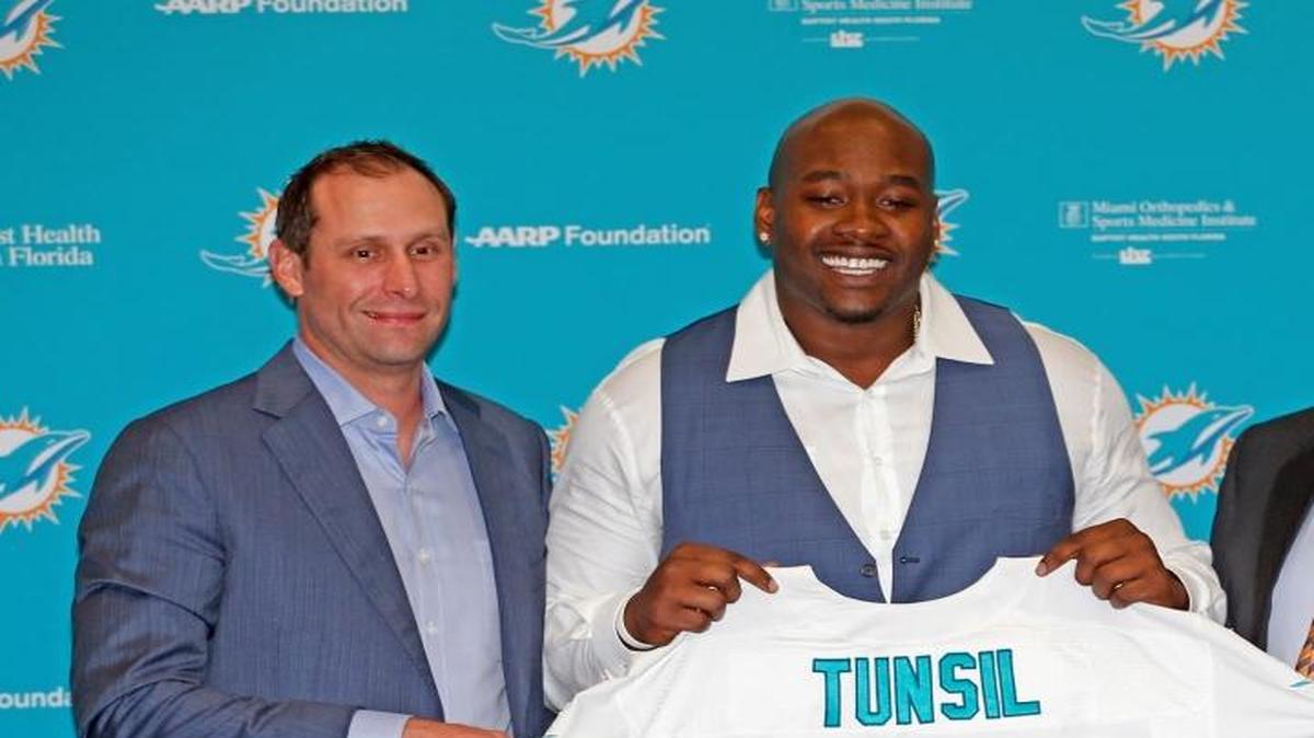 Miami Dolphins Head Coach Adam Gase and Executive Vice President of Football Operations Mike Tannenbaum stand with their first-round draft pick Laremy Tunsil at the Miami Dolphns training facilty in Davie on April 29, 2016. When asked about the recent controversy surrounding him, he said he was blessed to be in the NFL.