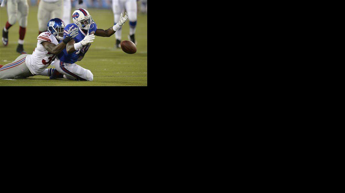 Buffalo Bills wide receiver T.J. Graham (11) can't reach the ball on a pass under pressure from New York Giants cornerback Zack Bowman (31) in the second quarter of the Pro Football Hall of Fame exhibition NFL football game Sunday, Aug. 3, 2014, in Canton, Ohio.