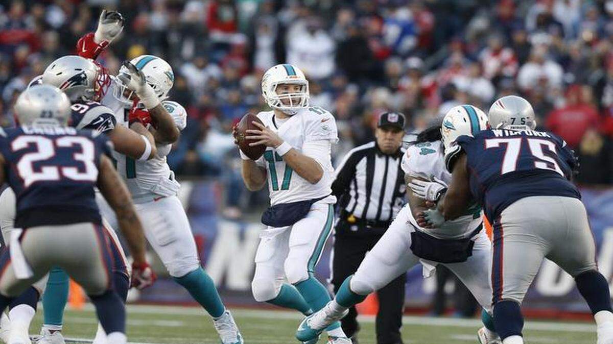 
Miami Dolphins quarterback Ryan Tannehill (17) drops back to pass in the third quarter as the New England Patriots host the Miami Dolphins at Gillette Stadium on Sunday, Dec. 14, 2014
