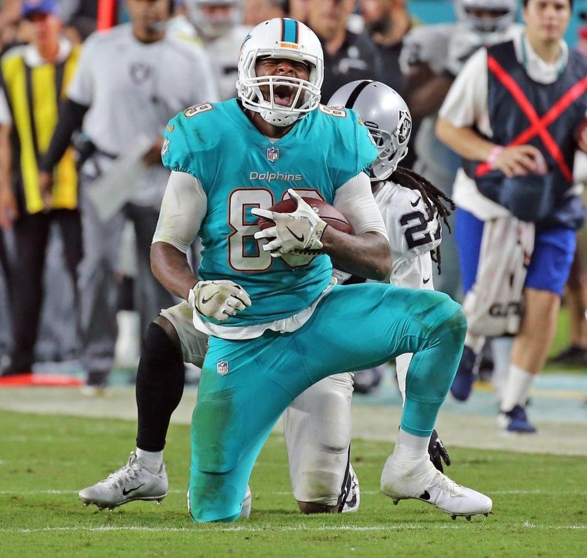 Miami Dolphins Julius Thomas (89) screams after a fourth quarter reception while playing the Oakland Raiders at Hard Rock Stadium in Miami Gardens, Florida, Nov. 5, 2017.