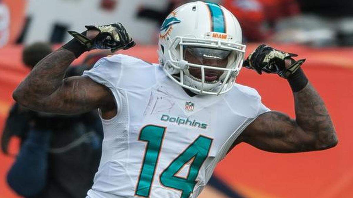 
Dolphins wide receiver Jarvis Landry celebrates a 20-yard reception against the host Denver Broncos on Nov. 23, 2014.
