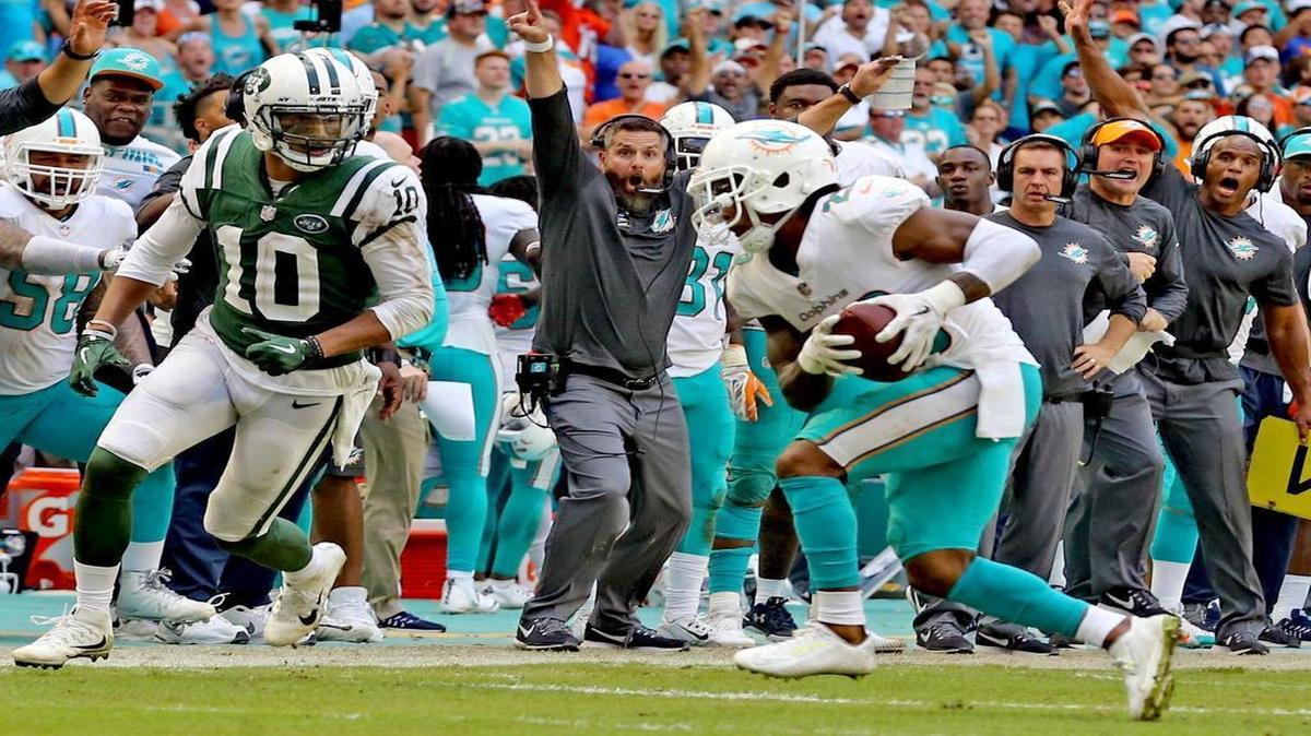 Miami Dolphins defensive coordinator Matt Burke reacts as Bobby McCain intercepts a pass against the New York Jets on Oct. 22, 2017.