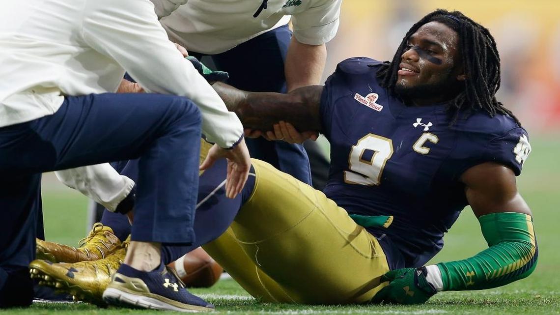 Notre Dame linebacker Jaylon Smith lays on the field after an injury during the first quarter of the Fiesta Bowl on Jan. 1.