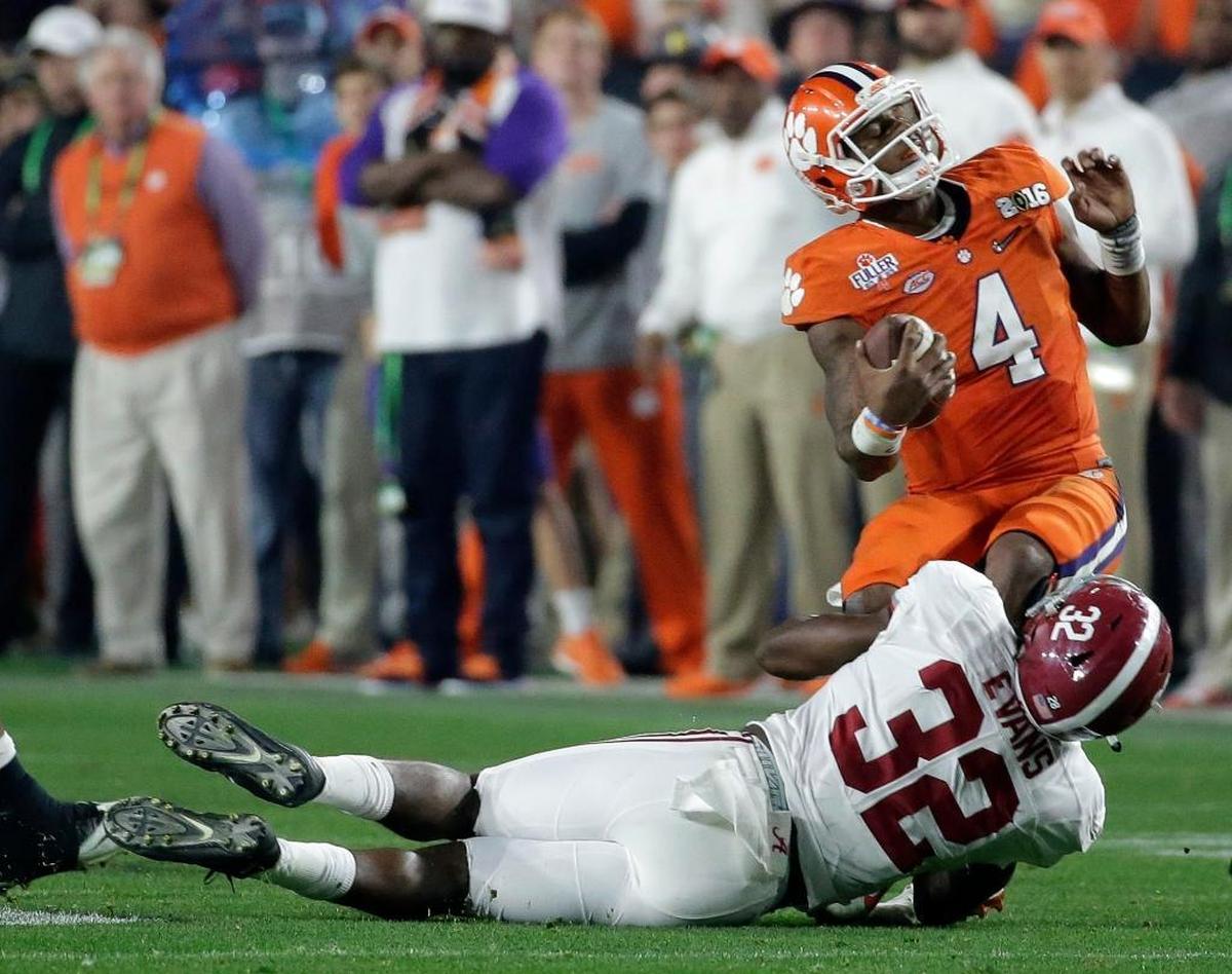 Alabama's Rashaan Evans (32) sacks Clemson quarterback Deshaun Watson during the second half of the NCAA college football playoff championship game in Glendale, Ariz. Evans, the star of Alabama's injury-depleted group, has had a big season on the field and graduated off it. He's also shined in the past two national title games.