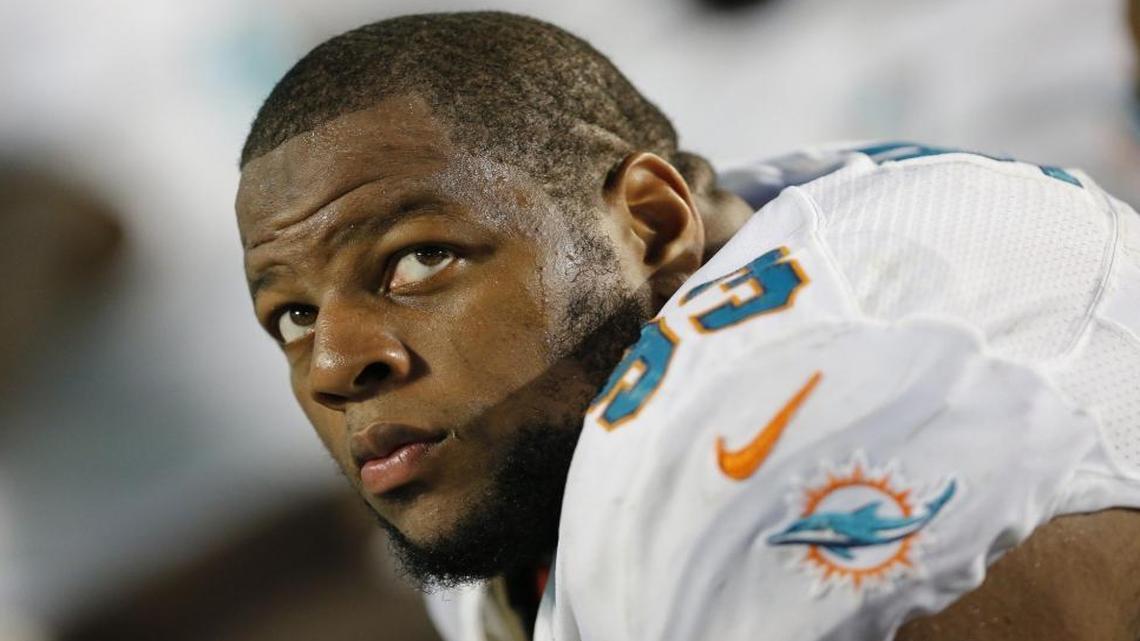 
Miami Dolphins defensive tackle Ndamukong Suh looks on from the bench during a 41-14 loss to the Buffalo Bills at Sun Life Stadium on Sunday, Sept. 27, 2015.
