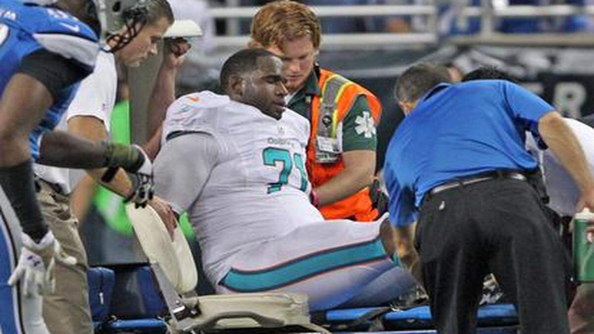 
Miami Dolphins left tackle Branden Albert is carted off after tearing the ACL and MCL in his right knee in the second quarter against the host Detroit Lions on Nov. 9, 2014.
