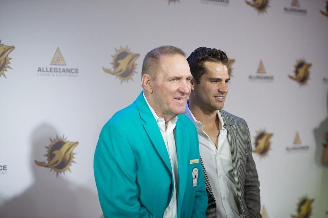 Jim Kiick and son Austin Kiick pose for photos during a red carpet event at the Dolphins gala for the 50th Season All Time Team at the Diplomat Resort and Spa in Hollywood, Fla., on Dec. 11, 2015.