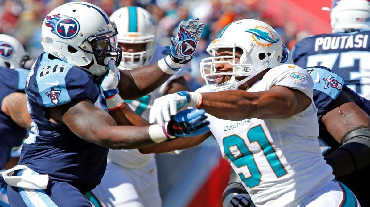 
Miami Dolphins defensive end Cameron Wake, who finished with four sacks, rushes against Tennessee Titans running back Antonio Andrews in the second quarter at Nissan Stadium in Nashville, Tenn., on Sunday, October 18, 2015.
