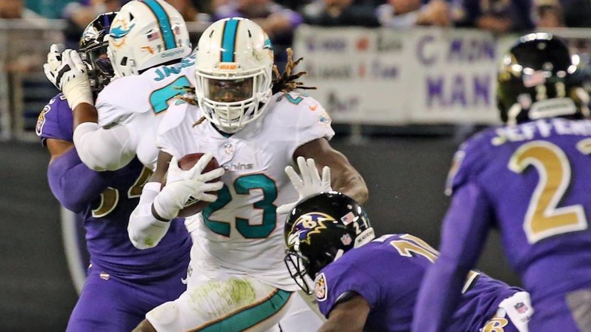 Miami Dolphins Jay Ajayi (23) runs the ball in the first quarter as Baltimore Ravens Lardarius Webb (21) defends at the M&T Bank Stadium in Baltimore, Maryland, Oct. 26, 2017.