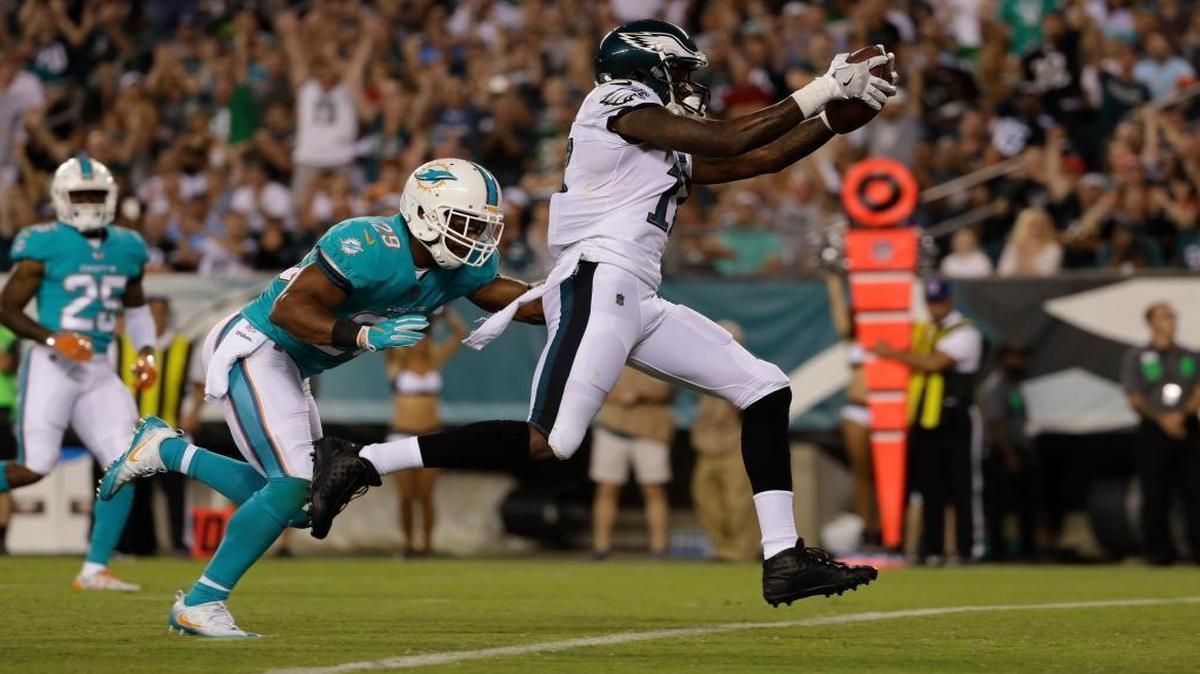 Philadelphia Eagles' Alshon Jeffery, right, scores a touchdown past Miami Dolphins' Nate Allen during the first half of a preseason NFL football game, Thurs., Aug. 24, 2017, in Philadelphia.