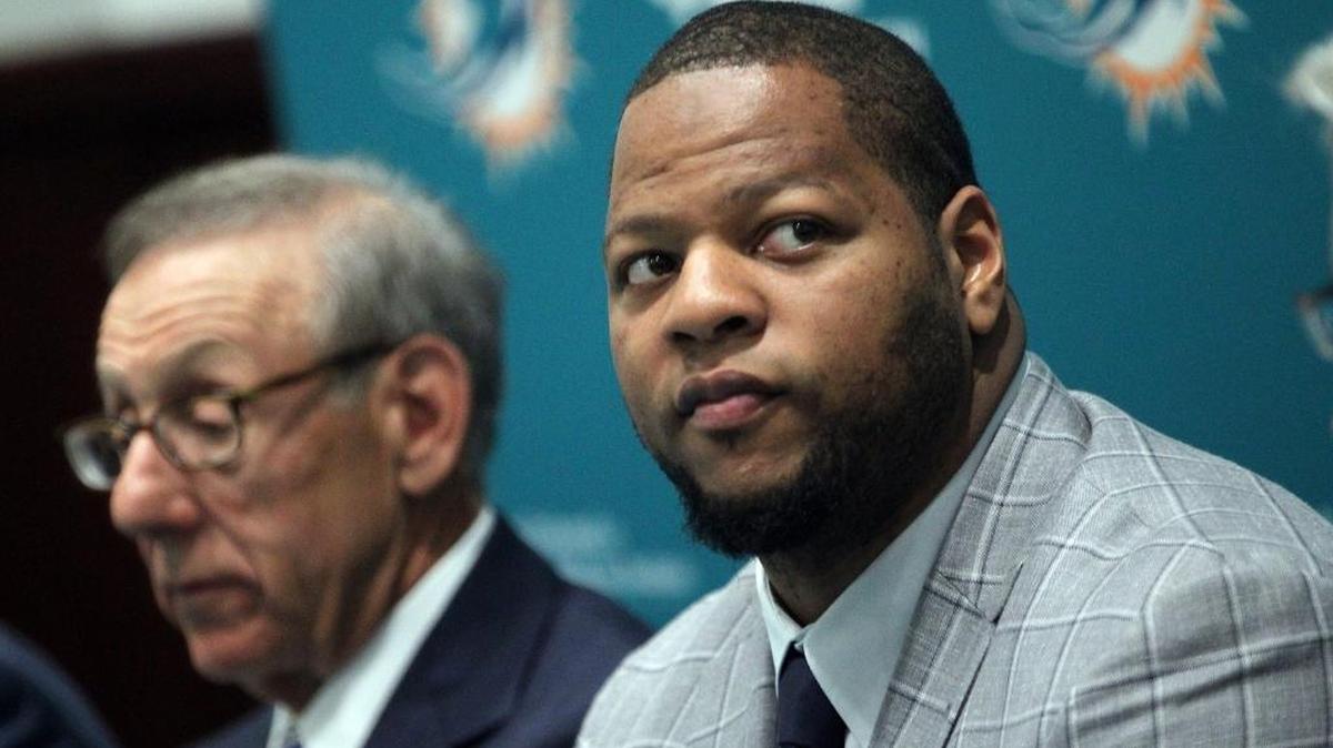Miami Dolphins defensive tackle Ndamukong Suh, right, is shown with Dolphins owner Stephen M. Ross at his introductory press conference on Wednesday, March 11, 2015.