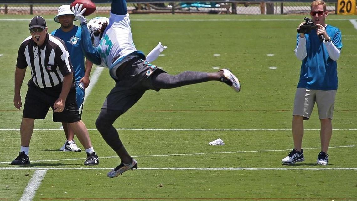 
Running back Jay Ajayi leaps to the air to make the catch during a Dolphins practice at their Davie headquarters on Monday, June 1, 2015. Dolphins rookie RB Jay Ajayi broke a rib in Dolphins' preseason loss to Buccaneers Thursday, Sept. 3, 2015.
