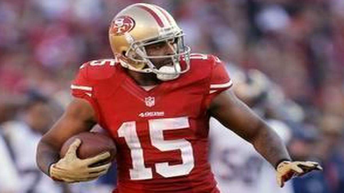 
San Francisco 49ers wide receiver Michael Crabtree (15) runs past St. Louis Rams cornerback Trumaine Johnson on a 60-yard reception during the third quarter of an NFL football game in San Francisco, Sunday, Dec. 1, 2013.
