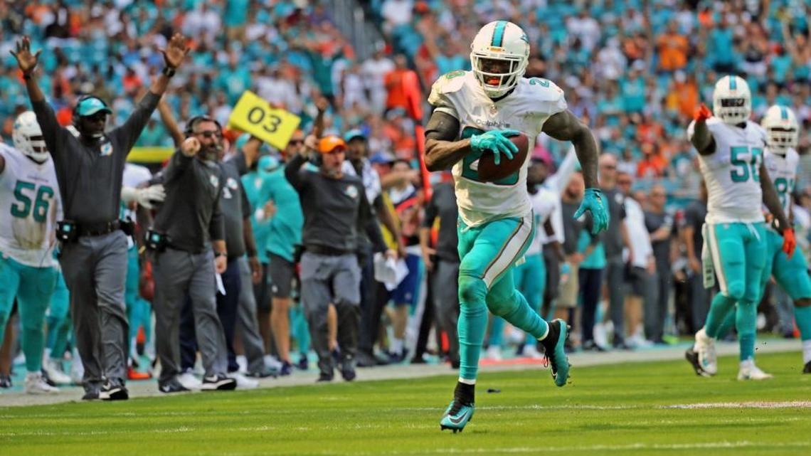 Miami Dolphins Reshad Jones (20) runs for a touchdown in the first quarter as they play the Tennessee Titans at Hard Rock Stadium in Miami Gardens, Florida, October 8, 2017.