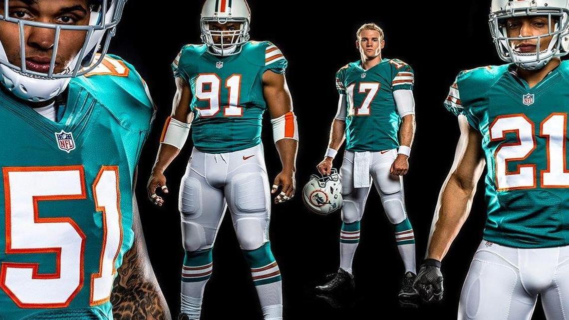 
The Miami Dolphins model the new throwback uniform.
