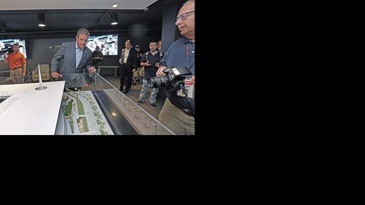 
Hall of Famer Dan Marino views the model of what Sun Life Stadium will look live after renovations on Tuesday, February 24, 2015.
