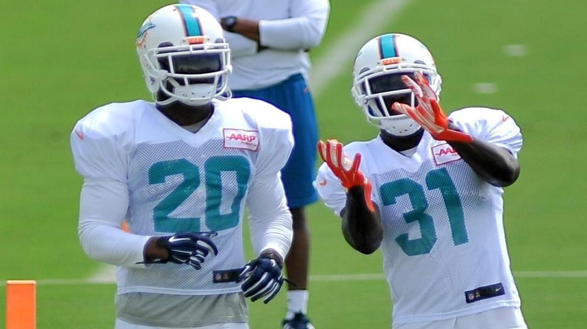 
Miami Dolphins safeties Reshad Jones (20) and Michael Thomas participate in practice Thursday, Sept. 17, 2015 in Davie. 

