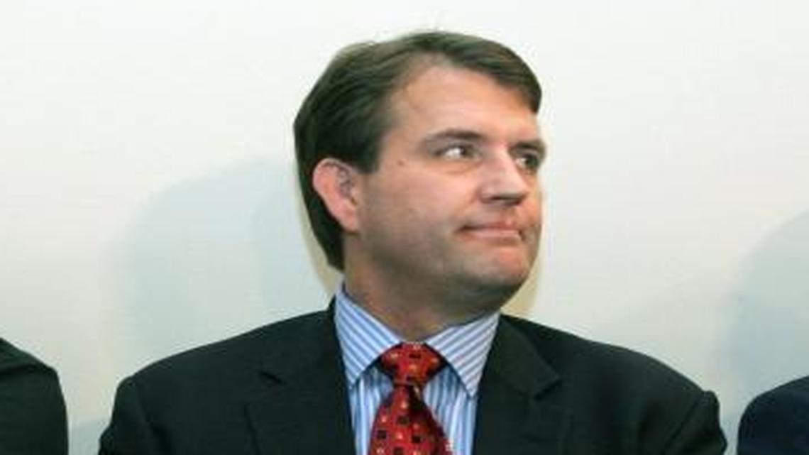 Miami Dolphins executives, from left, Bill Parcells, executive vice president of football operations; team president Bryan Wiedmeier; and owner Wayne Huizenga listen as Tony Sparano speaks to the media during a press conference naming Sparano as the new coach at team headquarters in Davie.