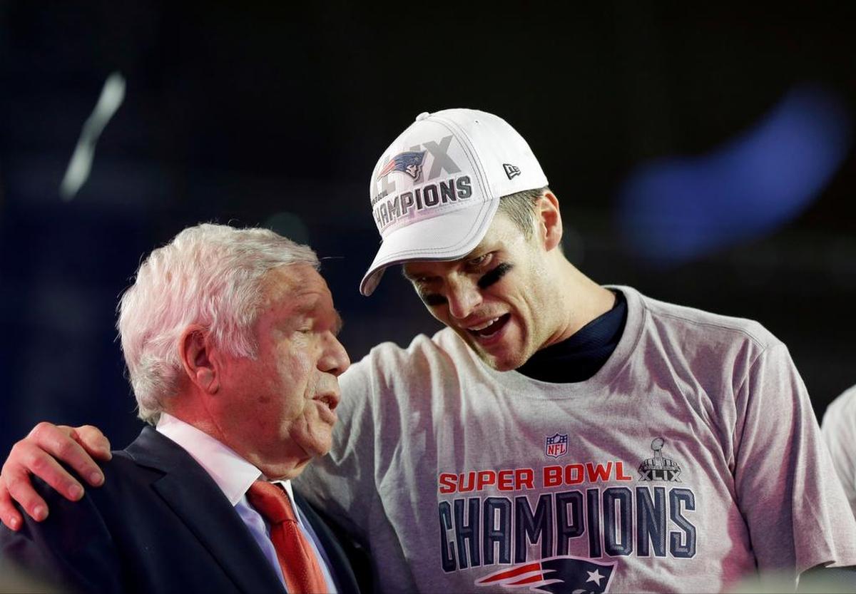 New England Patriots quarterback Tom Brady, right, celebrates with owner Robert Kraft after Super Bowl XLIX against the Seattle Seahawks Sunday, Feb. 1, 2015, in Glendale, Ariz. The Patriots won 28-24.