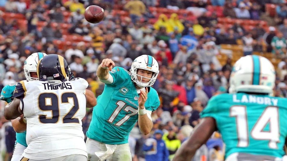 Miami Dolphins quarterback Ryan Tannehill throws a pass to Jarvis Landry, Landry caught the pass and ws pushed into the endzone to score in the fourth quarter Los Angeles Rams at the Los Angeles Memorial Coliseum in Los Angeles, California, Nov. 20, 2016.