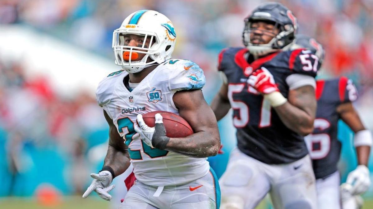 Miami Dolphins running back Lamar Miller (26) scores against the Houston Texans at Sun Life Stadium on Sunday, October 25, 2015.