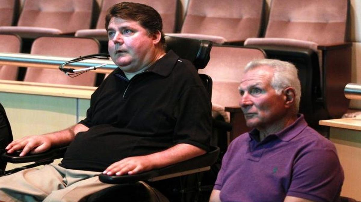 Emilio Estefan, Marc Buoniconti and Nick Buoniconti screen “Unbreakable Bond,” a film by Estefan that chronicles the relationship between Nick and Marc in this 2014 file photo.